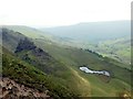 The Tower and tarn at Alport Castles in Hope Woodlands