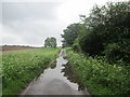 Partially flooded road in IP18 6UW