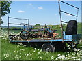 An old plough on an old trailer in SN11 0PP