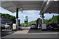 Hillside seen through petrol station/store forecourt in CA28 6LD