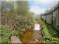 Rust-coloured stream in Tir-y-berth in CF82 8AH