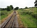 View from a Wareham-Swanage train - Farm track crossing near Leeson Wood in BH19 3BJ