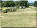 Footpath crossing fields, fences and stiles at Low Austby in LS29 0SB