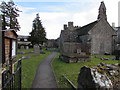 Path through St Peter's churchyard, St Pierre, Monmouthshire in NP16 6YA
