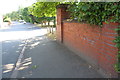 Brick wall on west side of Kingfield Road in CV6 5NX