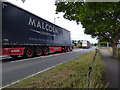 Malcolm Logistics trucks entering Fairlie in KA29 0AU