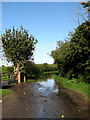 Flooded road to Weston Longville in NR9 5LA