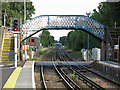 Footbridge and level crossing, Chertsey station in KT16 9LP