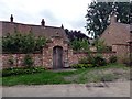 Gateway and wall to the Old Manor House in NG23 7DB