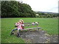 Scarecrow on bench, Front Street, New Hunwick in DL15 0LH