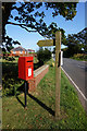 Post box & fingerpost on Withernsea Road at Nevills Bridge in HU19 2RA