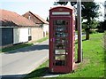 Disused K6 telephone box in School Road in NR15 1DD