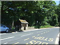 Bus stop and shelter on Glossop Road (A624), Little Hayfield in SK22 2NQ