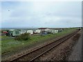 View from a Chester-Holyhead train - Beach-side caravans near Abergele in LL22 8FP