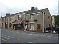 Grocers and houses on Blackburn Road, Egerton in BL7 9SR
