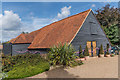 Manor Farm Tithe Barn in KT24 5NS