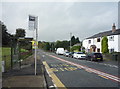 Bus stop and shelter on Bury and Rochdale Old Road in OL10 4BH