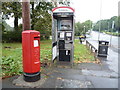 Elizabeth II postbox and telephone box on Victoria Avenue, Manchester in M9 0PR