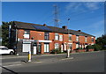 Shop and terraced housing on Middleton Road in M24 2EB