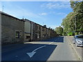 Terraced housing on Edenfield Road, Wolstenholme in OL12 7TR