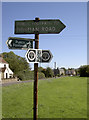 Footpath signpost on Goose Green in BS30 5LU