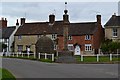 Village green with lock-up and memorial, Steeple Ashton in BA14 6ET