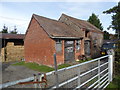 Buildings on a smallholding south of Longden Common in SY5 8AE