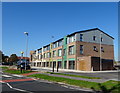 New development of shops with flats over, Kirkholt in OL11 2RZ