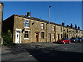 Terraced housing on Shawclough Road (B6377) in OL12 7DQ