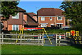 Play area and houses at Rushington in SO40 9UZ