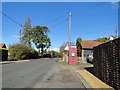 Disused telephone box with defibrillator in NR14 8NA