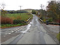 Minor road and bridge crossing Markie Water at Haugh of Glass in AB54 4XY