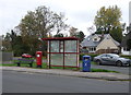 Elizabeth II postbox and bus stop on Pope Lane, White Stake in PR4 4JS