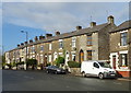 Terraced housing on Oldham Road, Springhead in OL4 4PE