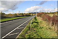 Looking west along the eastbound carriageway of the A65 in BD23 1GH
