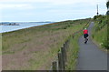 Cycling east along the Fife Coastal Path in DD6 8QX