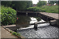Weir and footbridge on the Kingshurst Brook, Chelmsley Wood, east Birmingham in B37 5LG