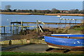 Blue boat and jetties on Stanpit shore in BH23 3LL