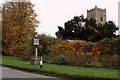 The village sign and St. Mary's church at Bacton in Bacton (Mid Suffolk)