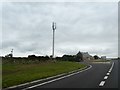 House and phone mast at Preeze Cross in PL30 4HH