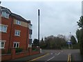 Black communications mast, Woodbrook Road, Loughborough in LE11 3JA