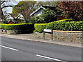 Walls, hedges and a bilingual name sign, Henfaes Road, Tonna in SA11 3EU
