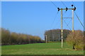 Power lines crossing field in SO20 6JJ