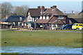 The Fighting Cocks public house, seen across pond and green in Fordingbridge, Godshill & Hyde Ward