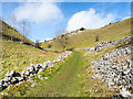 Grassy road rising out of Lathkill Dale in DE45 1JF