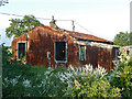 Derelict tin house in RM18 8TT