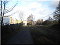 Path and tramway passing site of Swan Village station, West Bromwich in B70 0YA