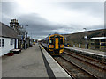 A class 158 train departing from Rogart Station in IV28 3YH