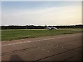 Aeroplane taxiing to main runway at London Stansted Airport in CM24 1RE
