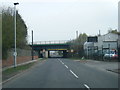 Kilnhurst Road passes under railway bridge in S64 8NZ